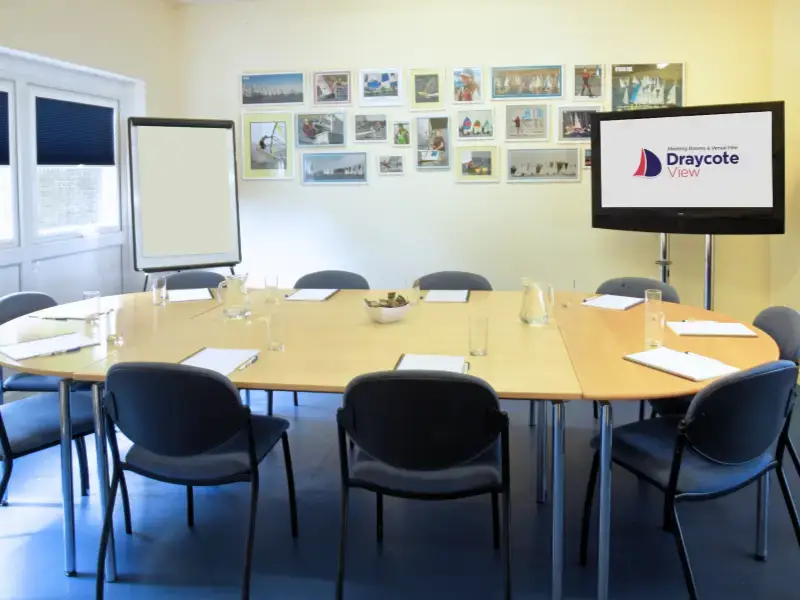 Meeting room with oval table and chairs