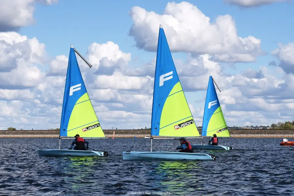 3 Fusion dinghies sailing during Improvers Group