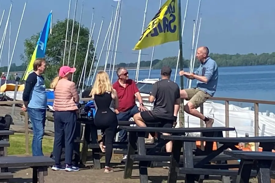 Novice racers gather for a briefing